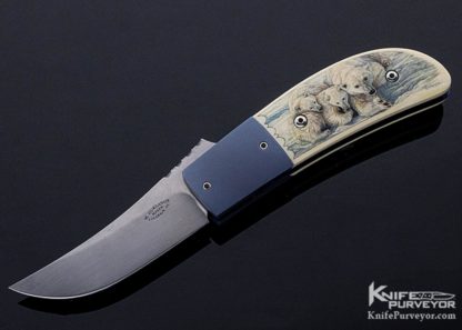 Knife Maker: Melvin Gurganus, it is a Custom Knife that features K. Petersen Mammoth with a Scrimshawed Polar Bear and is a Linerlock knife