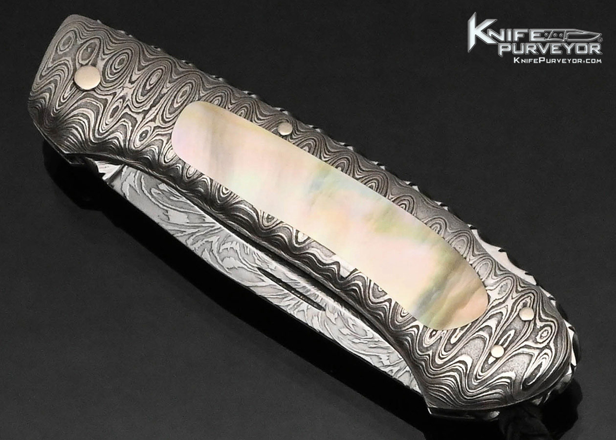 Kay Embretsen Custom Knife Starburst Pattern Damascus Blade with Damascus and Gold Lip Pearl Interframe Lockback
