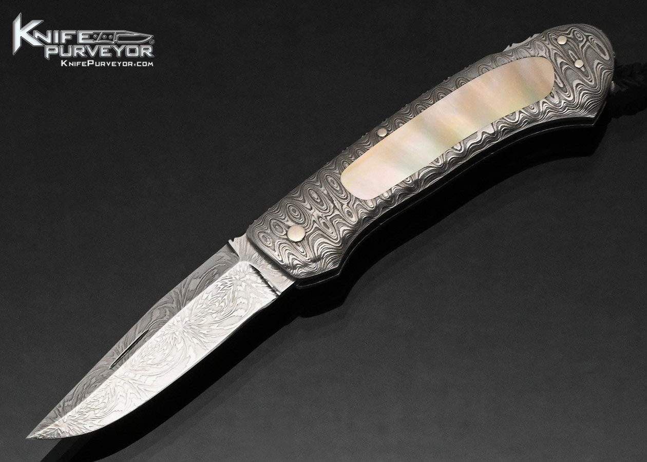 Kay Embretsen Custom Knife Starburst Pattern Damascus Blade with Damascus and Gold Lip Pearl Interframe Lockback