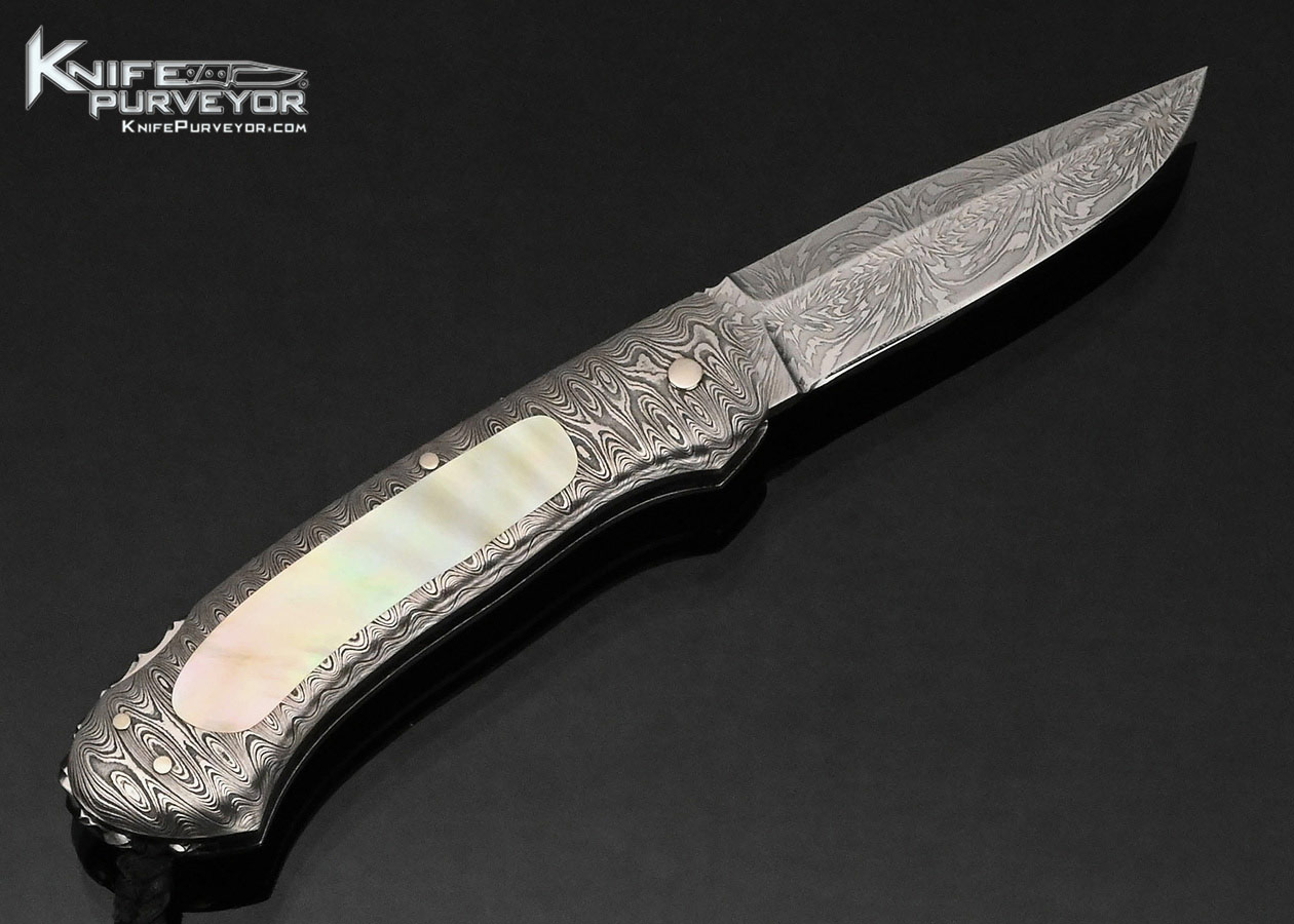 Kay Embretsen Custom Knife Starburst Pattern Damascus Blade with Damascus and Gold Lip Pearl Interframe Lockback