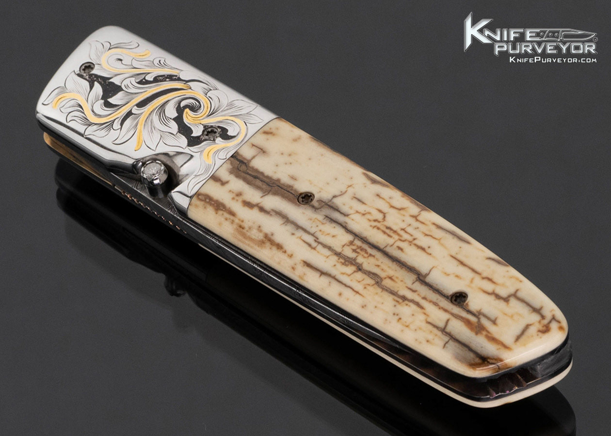 jerry-mcclure-custom-knife-engraved-with-gold-inlays-and-wooly-mammoth-linerlock-17790