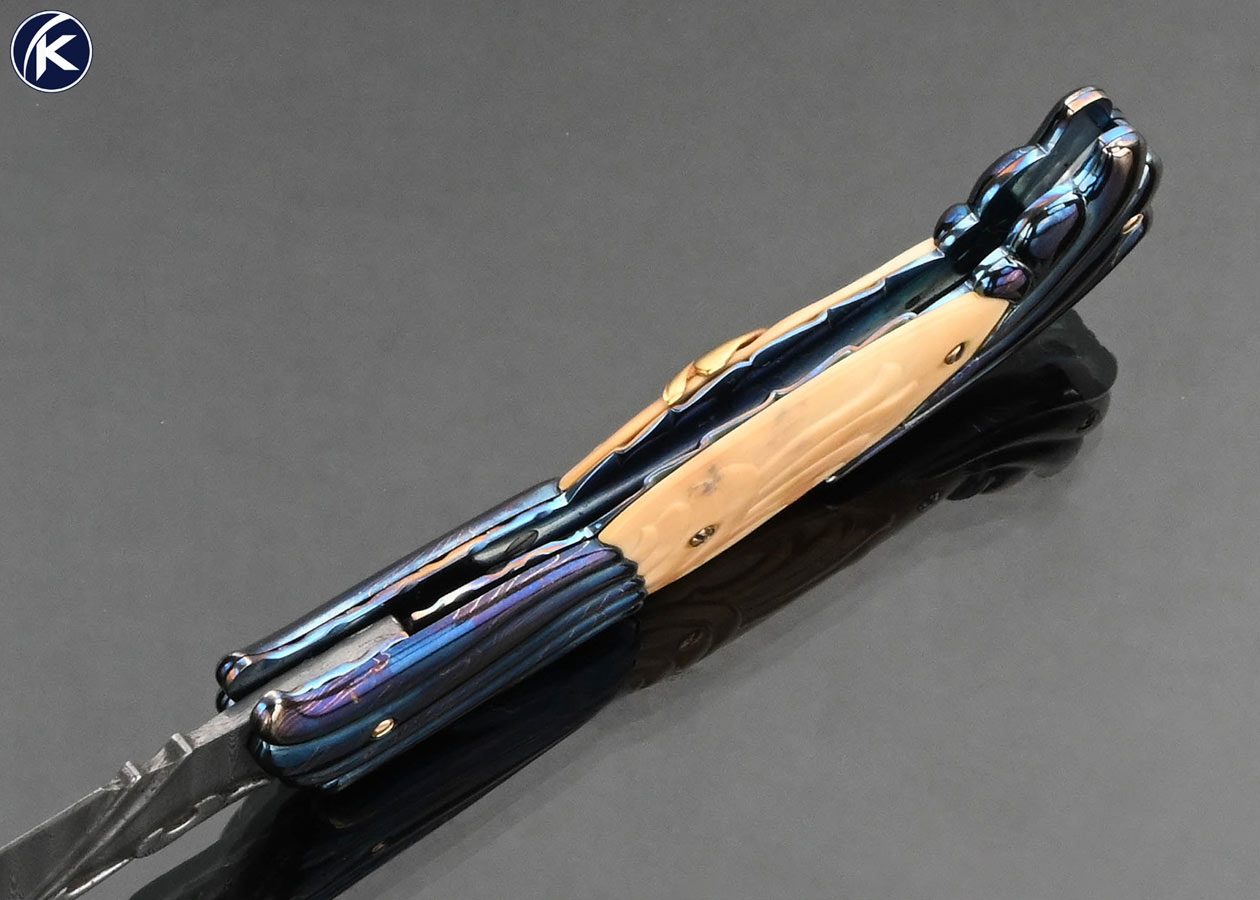 Stephen Olszewski Custom Knife "Mardi Gras" Blued Damascus with Carved Mammoth Automatic Linerlock