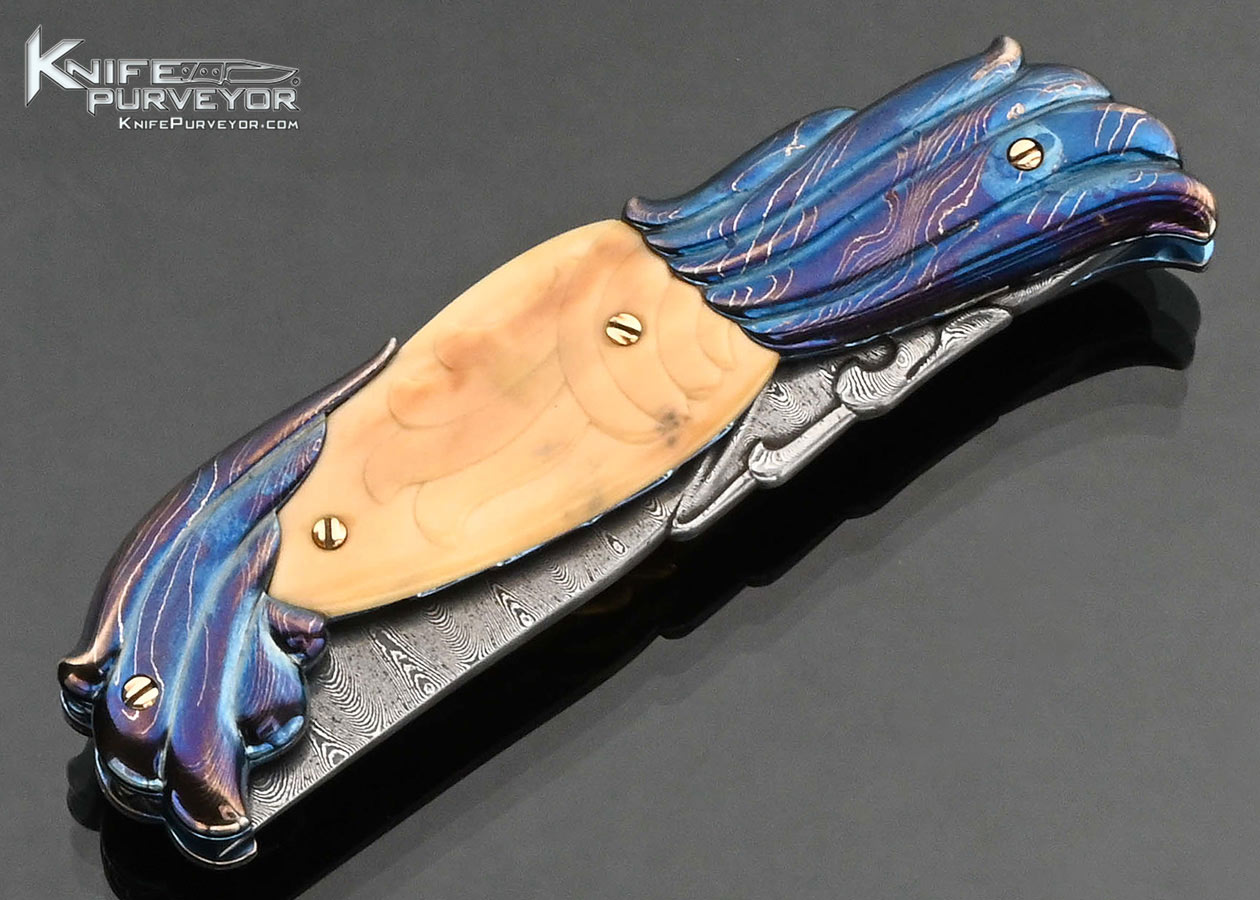 Stephen Olszewski Custom Knife "Mardi Gras" Blued Damascus with Carved Mammoth Automatic Linerlock