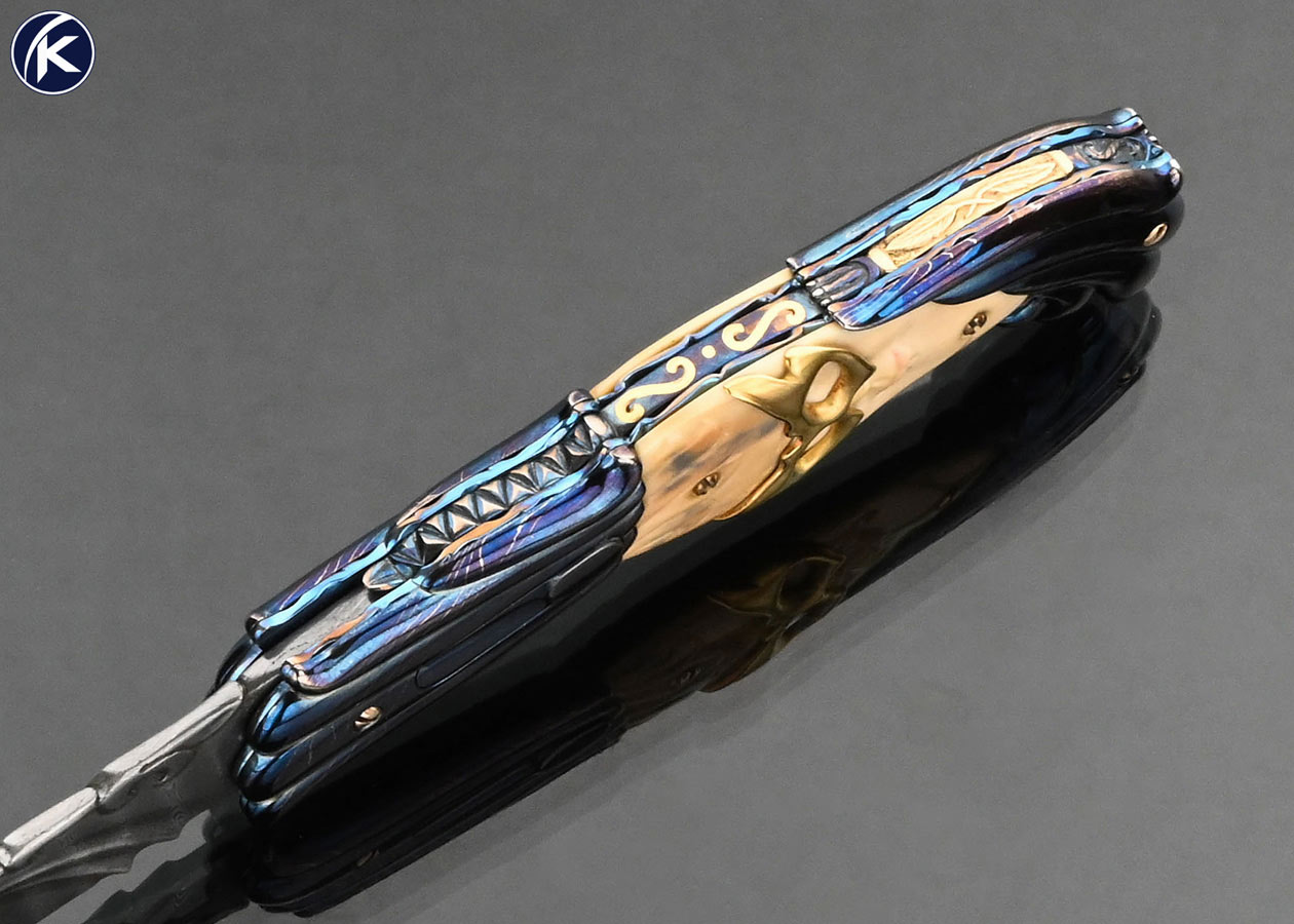 Stephen Olszewski Custom Knife "Mardi Gras" Blued Damascus with Carved Mammoth Automatic Linerlock