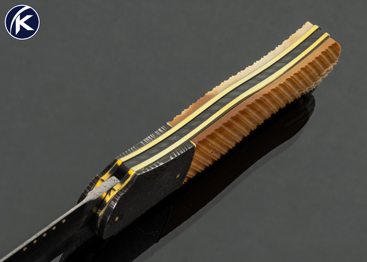 Owen Wood Custom Knife Sole Authorship Chevron and Twist Damascus with 24Kt Gold Inlays and Mosaic Damascus Bolsters with Fluted Fossil Walrus Linerlock Dagger - Image 4