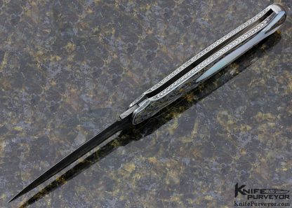 Tom Overeynder Custom Knife Mother of Pearl Shell Semi Interframe Lockback Dagger with Owen Wood "Chevron & Flame" Damascus Loclback Dagger Engraved by Joe Mason - Image 5