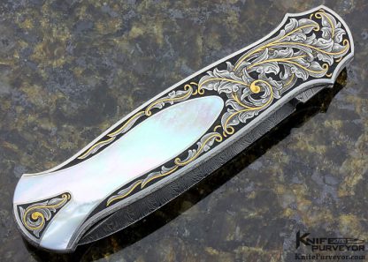 Tom Overeynder Custom Knife Mother of Pearl Shell Semi Interframe Lockback Dagger with Owen Wood "Chevron & Flame" Damascus Loclback Dagger Engraved by Joe Mason - Image 3