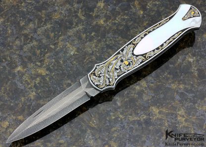 Tom Overeynder Custom Knife Mother of Pearl Shell Semi Interframe Lockback Dagger with Owen Wood "Chevron & Flame" Damascus Loclback Dagger Engraved by Joe Mason