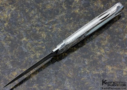 Tom Overeynder Custom Knife Mother of Pearl Shell Semi Interframe Lockback Dagger with Owen Wood "Chevron & Flame" Damascus Loclback Dagger Engraved by Joe Mason - Image 4