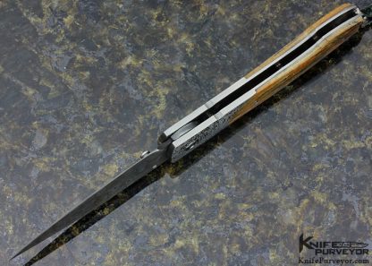 William Henry Custom Knife A.G. Russell Exclusive Mammoth Bark, Stippled Titanium and Mike Norris Raindrop Damascus with Sapphires Button Lock - Image 6