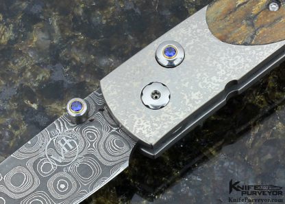 William Henry Custom Knife A.G. Russell Exclusive Mammoth Bark, Stippled Titanium and Mike Norris Raindrop Damascus with Sapphires Button Lock - Image 2