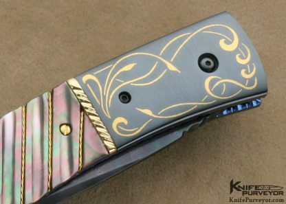 Jim and Joyce Minnick Custom Knife Blued Damascus with 24Kt Gold Inlaid Blued Steel Bolsters and Fluted Black Lip Tahitian Pearl Shell Drop Point Linerlock - Image 5