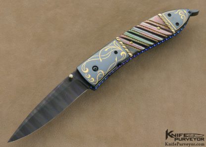 Jim and Joyce Minnick Custom Knife Blued Damascus with 24Kt Gold Inlaid Blued Steel Bolsters and Fluted Black Lip Tahitian Pearl Shell Drop Point Linerlock
