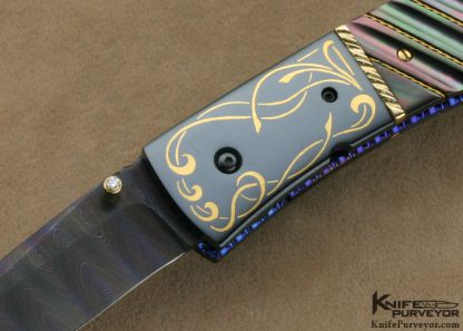 Jim and Joyce Minnick Custom Knife Blued Damascus with 24Kt Gold Inlaid Blued Steel Bolsters and Fluted Black Lip Tahitian Pearl Shell Drop Point Linerlock - Image 2