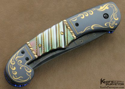Jim and Joyce Minnick Custom Knife Blued Damascus with 24Kt Gold Inlaid Blued Steel Bolsters and Fluted Black Lip Tahitian Pearl Shell Persian Linerlock - Image 3