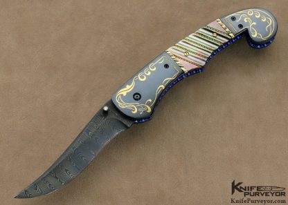 Jim and Joyce Minnick Custom Knife Blued Damascus with 24Kt Gold Inlaid Blued Steel Bolsters and Fluted Black Lip Tahitian Pearl Shell Persian Linerlock