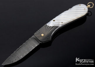 Knifemaker: Joe Kious. I t is a Custom Knife, made of: Fluted Mother of Pearl and Damascus