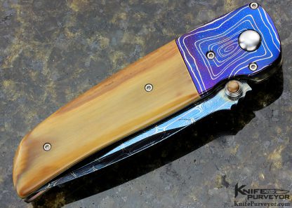 Larry Chew Custom Knife "Fancy Covert" with Robert Eggerling Blued Barb Wire/Jellyroll Mosaic Damascus with Mastodon Scales, Double Thumb Stud Hidden Auto Button Release - Image 3