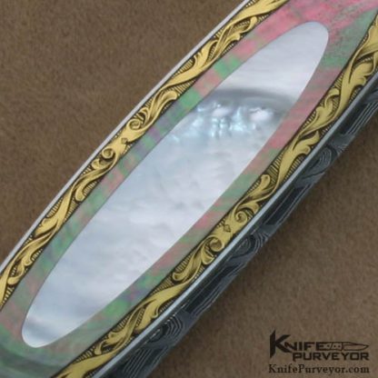Warren Osborne Custom Knives Brian Hochstrat Engraved Mother of Pearl & Blacklip Pearl Double Interframe Lockback Dagger with a Mike Norris Stainless Damascus Blade - Image 4
