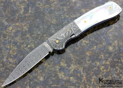 R.B Johnson Custom Knife Damascus and Mother of Pearl Lever Release Lock Back Auto
