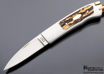 Ron Lake Custom Knife 2007 AKI Catalog Cover Knife Tail Lock with 14 Kt Gold Tab Release Stag Double Signature and Double Gold Escutcheons Double Nail Nick