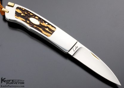 Ron Lake Custom Knife 2007 AKI Catalog Cover Knife Tail Lock with 14 Kt Gold Tab Release Stag Double Signature and Double Gold Escutcheons Double Nail Nick - Image 3