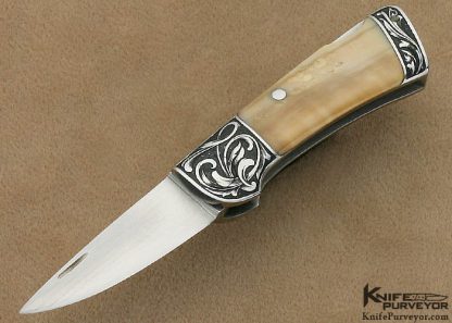 T.M. Dowell Custom Knife Fossilized Walrus Ivory Lockback Engraved by Ron Skaggs