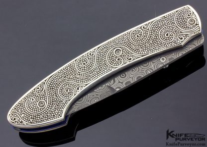 William Henry Custom Knife T12 Mardi Gras with Raindrop Damascus Carved Sterling Silver Beads and Wire-Work Scales and Opal Thumbstud - Image 3